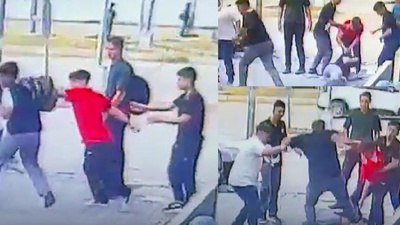İki çocuk akranını acımasızca dövüp yerde sürükledi: O anlar kamerada