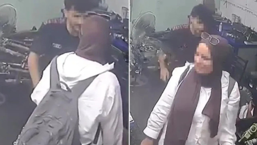 Erkekleri zorla öpmeye çalışan kadını gözaltına aldılar - Resim : 1